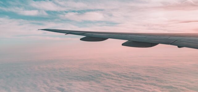 flying plane above sky white plane wing
